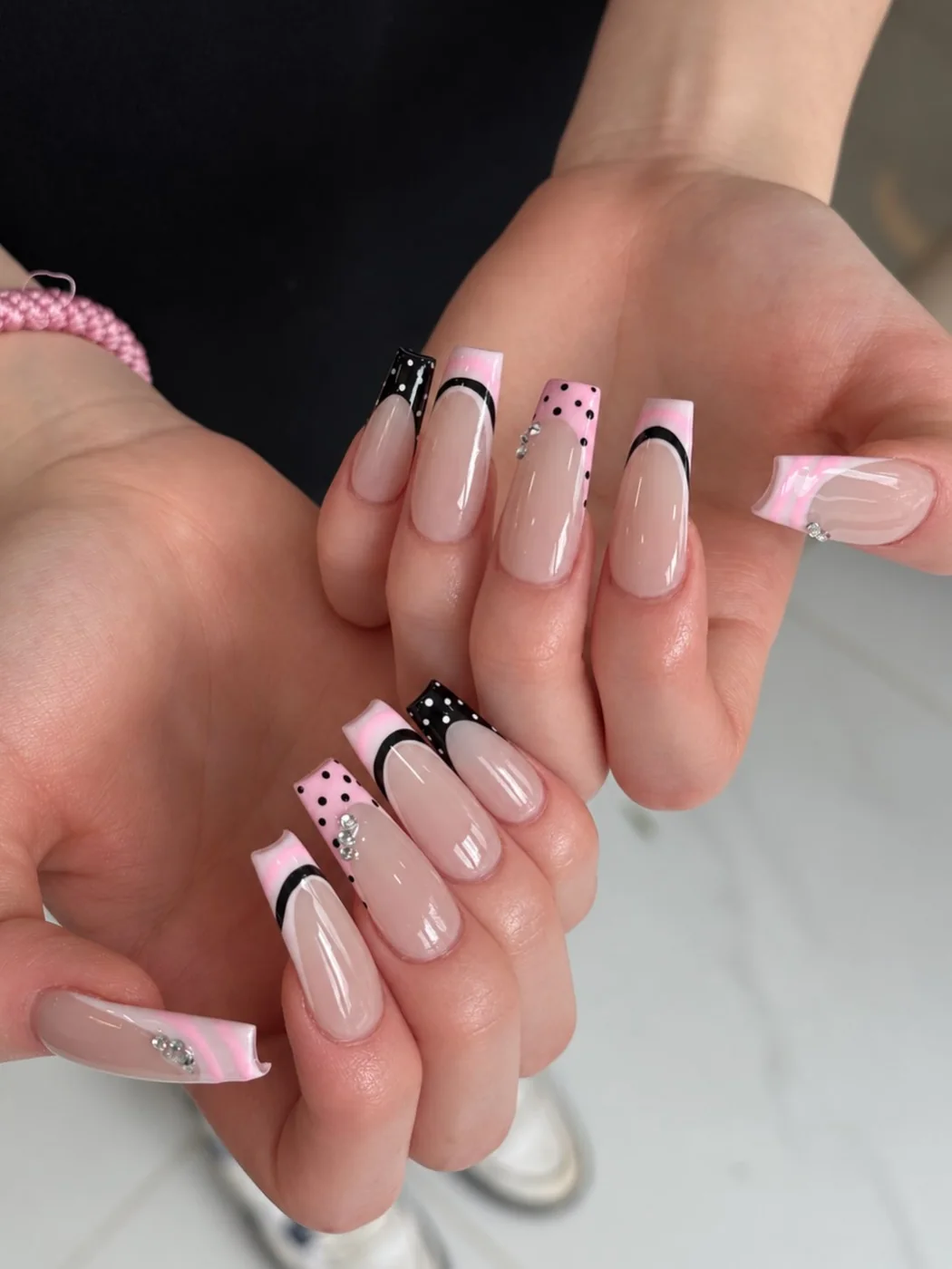 Pink ribbon nail art at ESTI Nails Studio